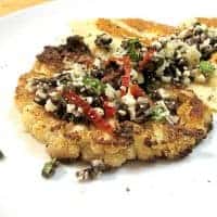 Roasted cauliflower steaks with olive relish and tomato sauce