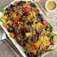 roasted beet and citrus salad on white plate