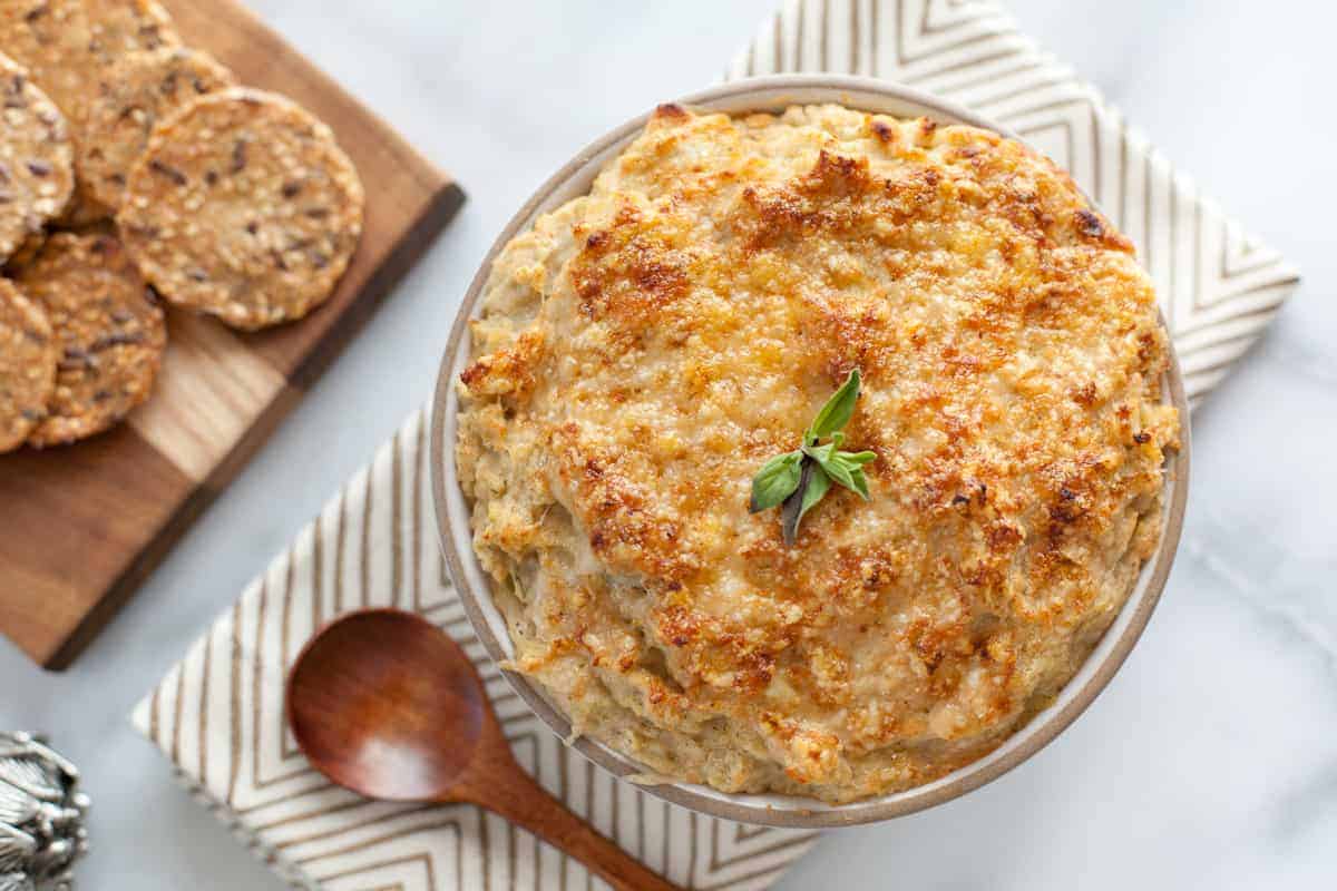 Baked white bean and artichoke dip with crackers