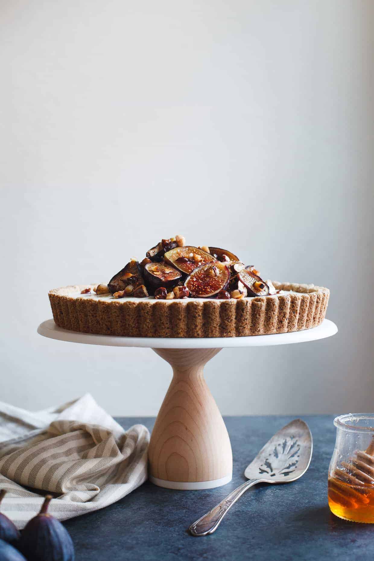 Ginger Goat Cheese Cheesecake with Roasted Figs and Hazelnuts