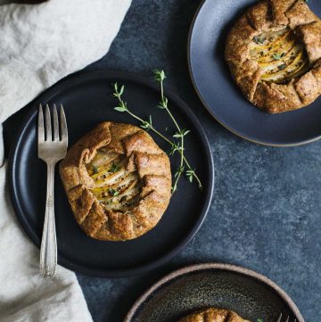 Apple, Cheddar, & Caramelized Onion Galettes with Gluten-Free Buckwheat Crust