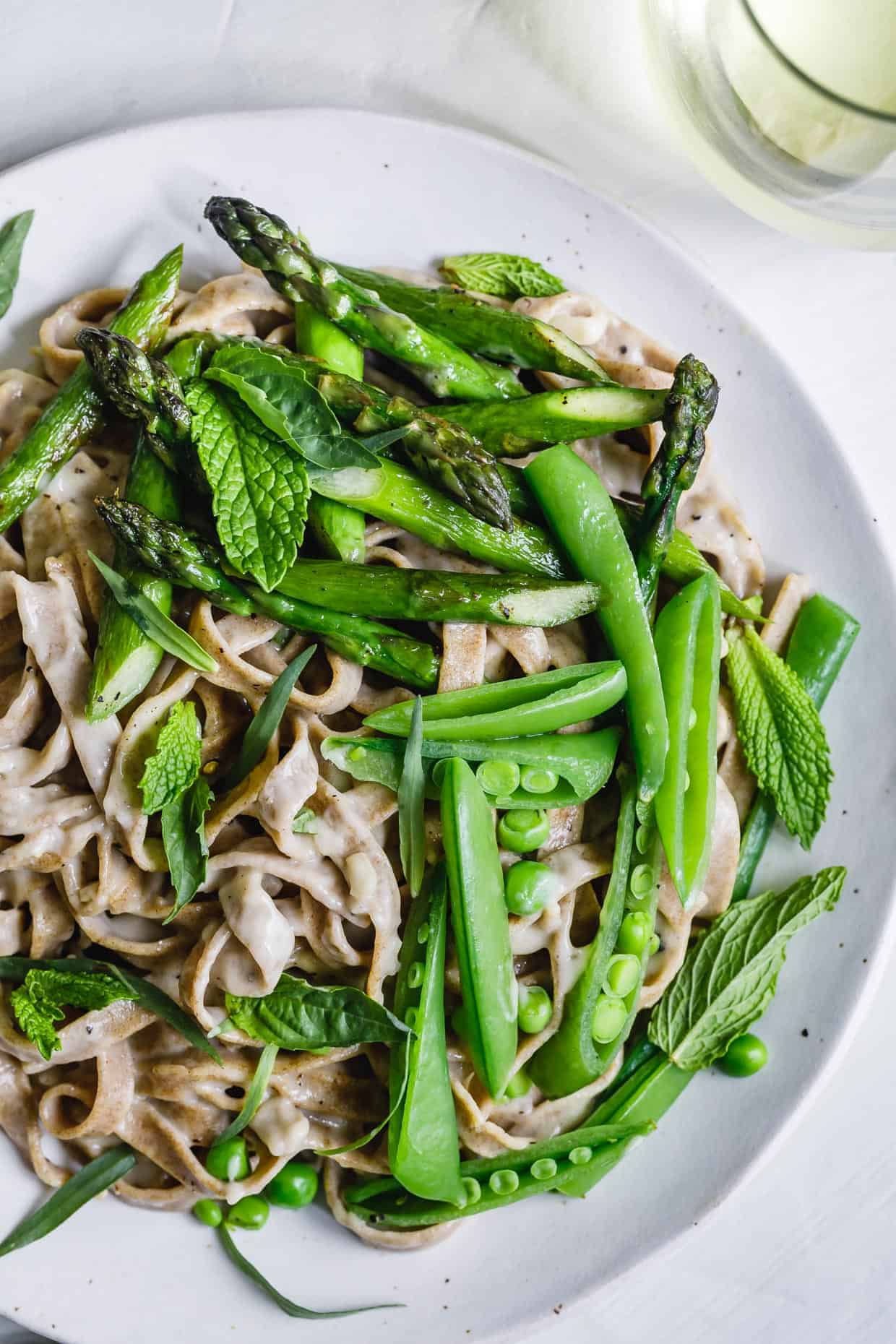 Almond Milk Fettuccine Alfredo with Spring Veggies & Herbs