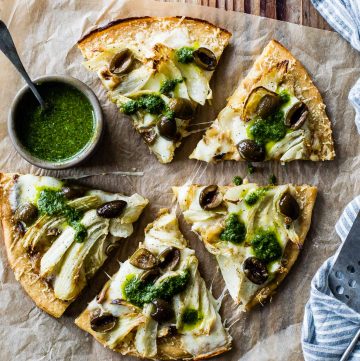 Roasted Fennel & Garlic Socca Flatbread with Olives and Mint Parsley Oil