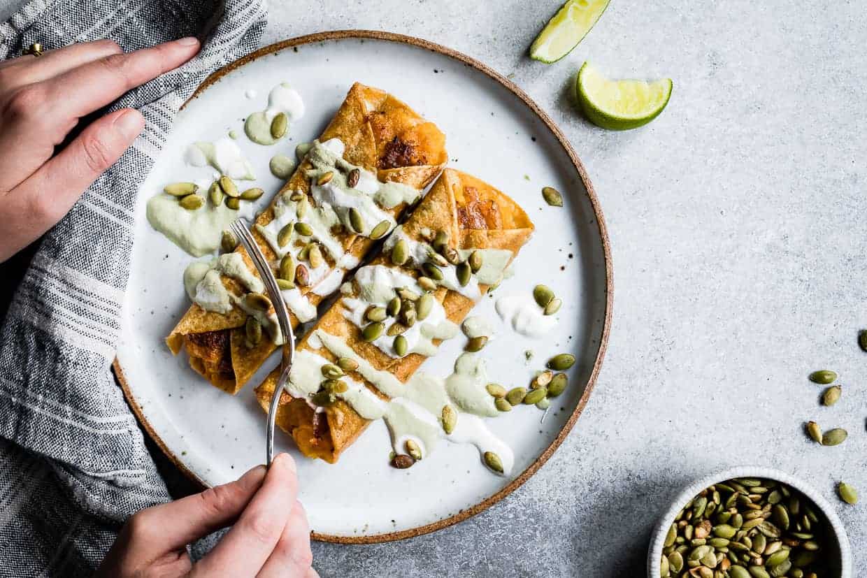 Cheesy Pumpkin Taquitos with Roasted Jalapeno Pepita Crema