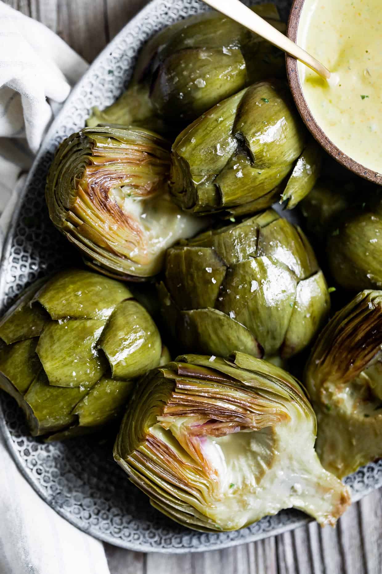 White Wine Braised Artichokes with Cashew Mandarin Tarragon Aioli