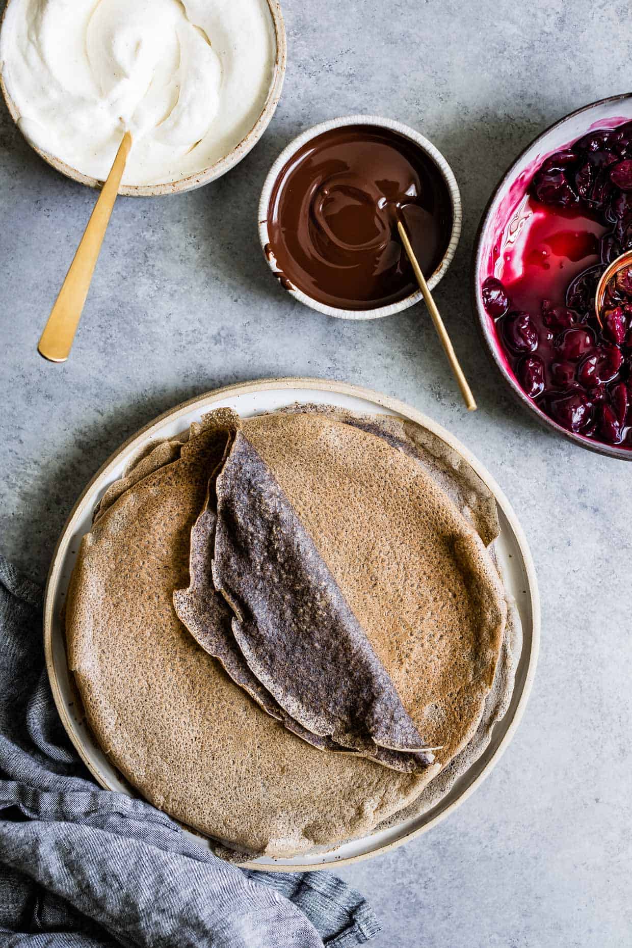 Buckwheat Crepes with Roasted Cherries, Whipped Cream, and Chocolate