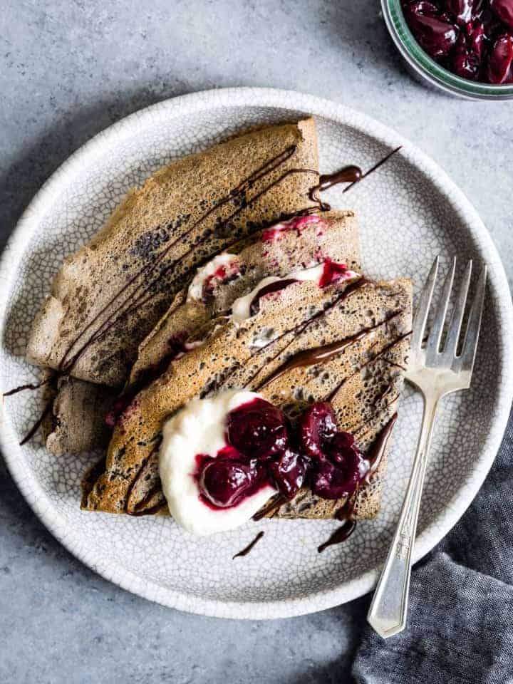 Buckwheat Crepes with Roasted Cherries, Whipped Cream, and Chocolate