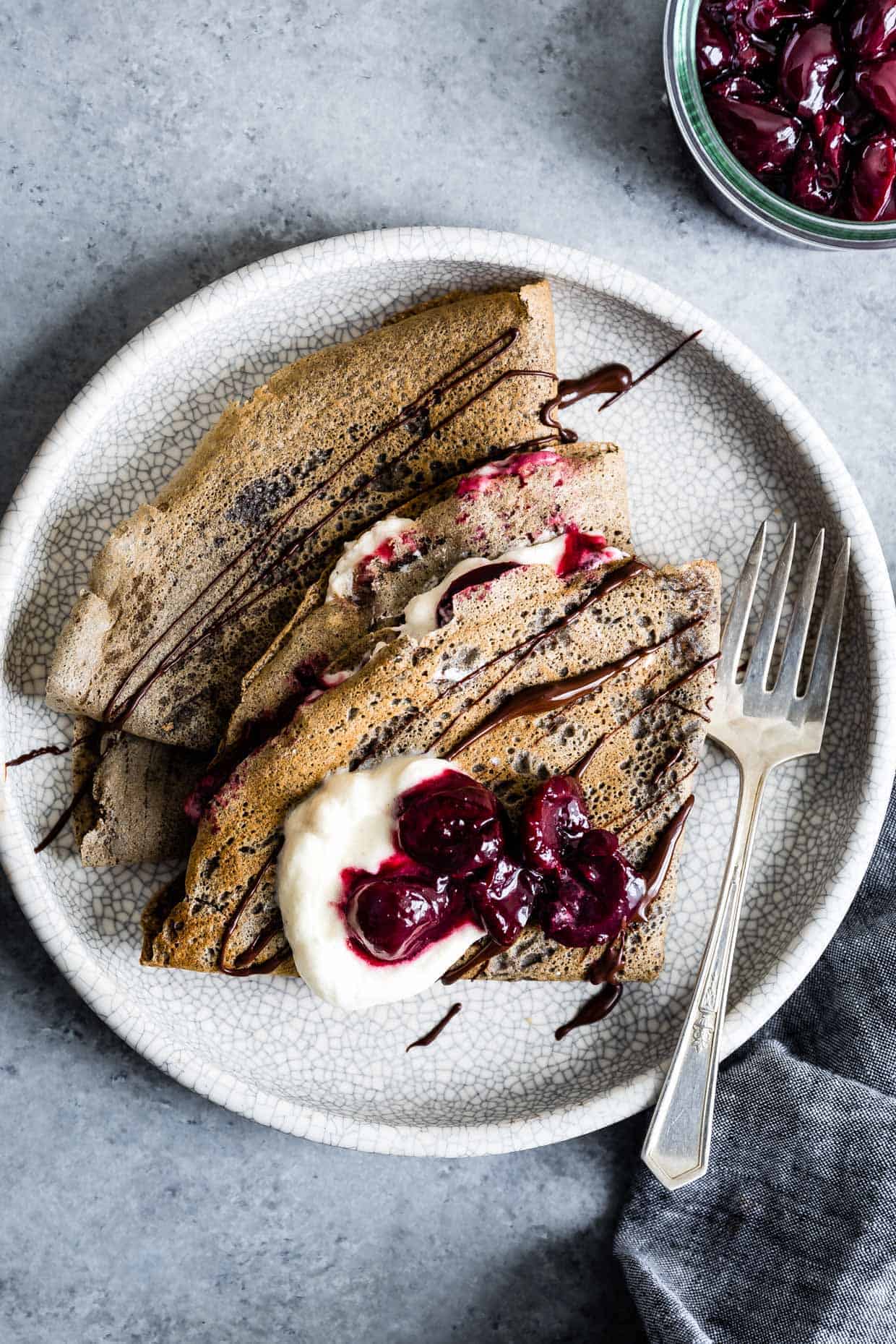 Buckwheat Crepes with Roasted Cherries, Whipped Cream, and Chocolate