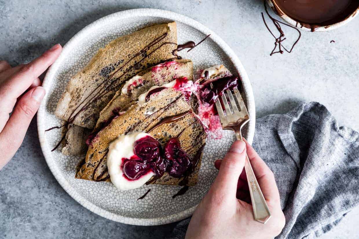 Buckwheat Crepes with Roasted Cherries, Whipped Cream, and Chocolate