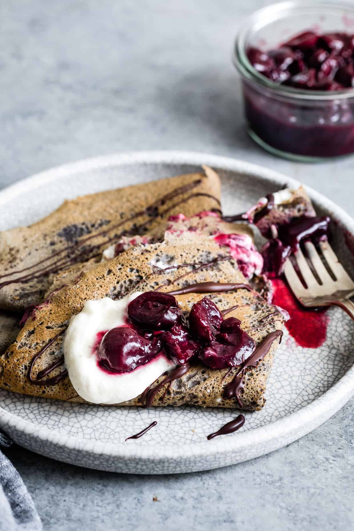 Buckwheat Crepes with Roasted Cherries, Whipped Cream, and Chocolate