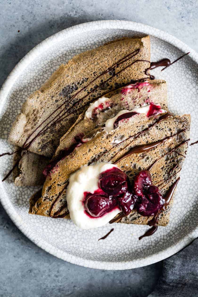 Buckwheat Crepes with Roasted Cherries, Whipped Cream, and Chocolate