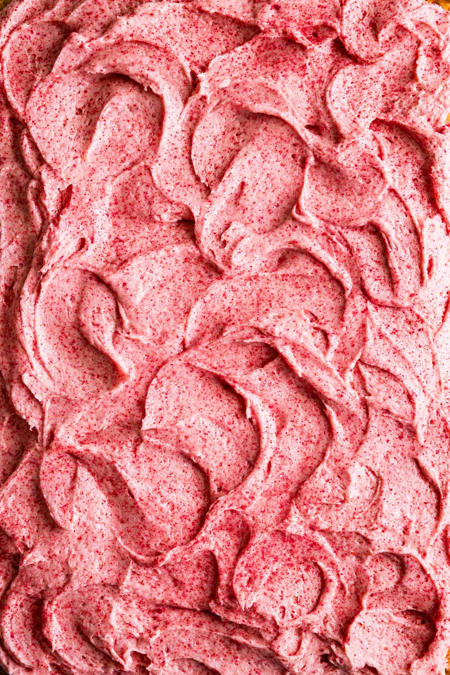 Swirls of raspberry cream cheese frosting