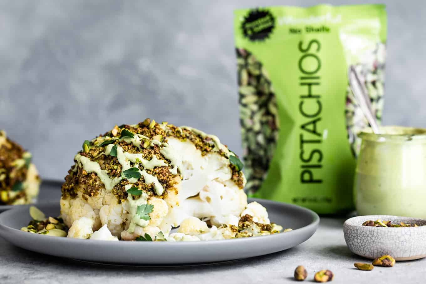 Pistachio-Crusted Whole Roasted Cauliflower with Pistachio Cream SaucePistachio-Crusted Whole Roasted Cauliflower with Pistachio Cream Sauce