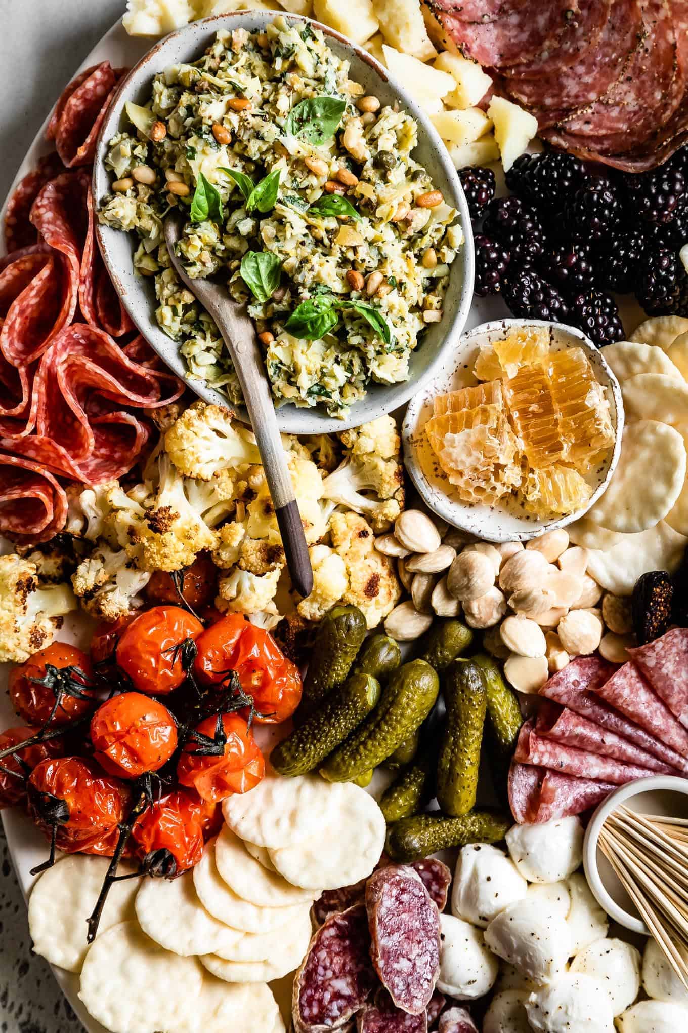 https://www.snixykitchen.com/wp-content/uploads/2019/05/How-to-Build-Dinner-Worthy-Charcuterie-Board-Basil-Artichoke-Tapenade-4.jpg