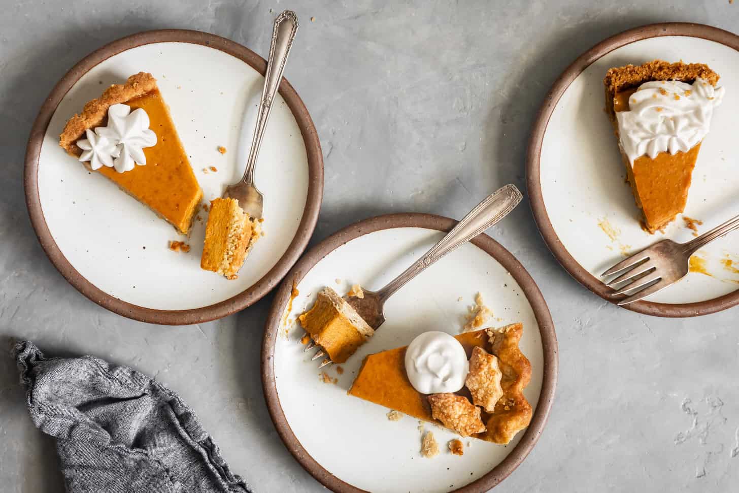Slices of Gluten-Free Dairy-Free Pumpkin Pie with Three Different Crusts
