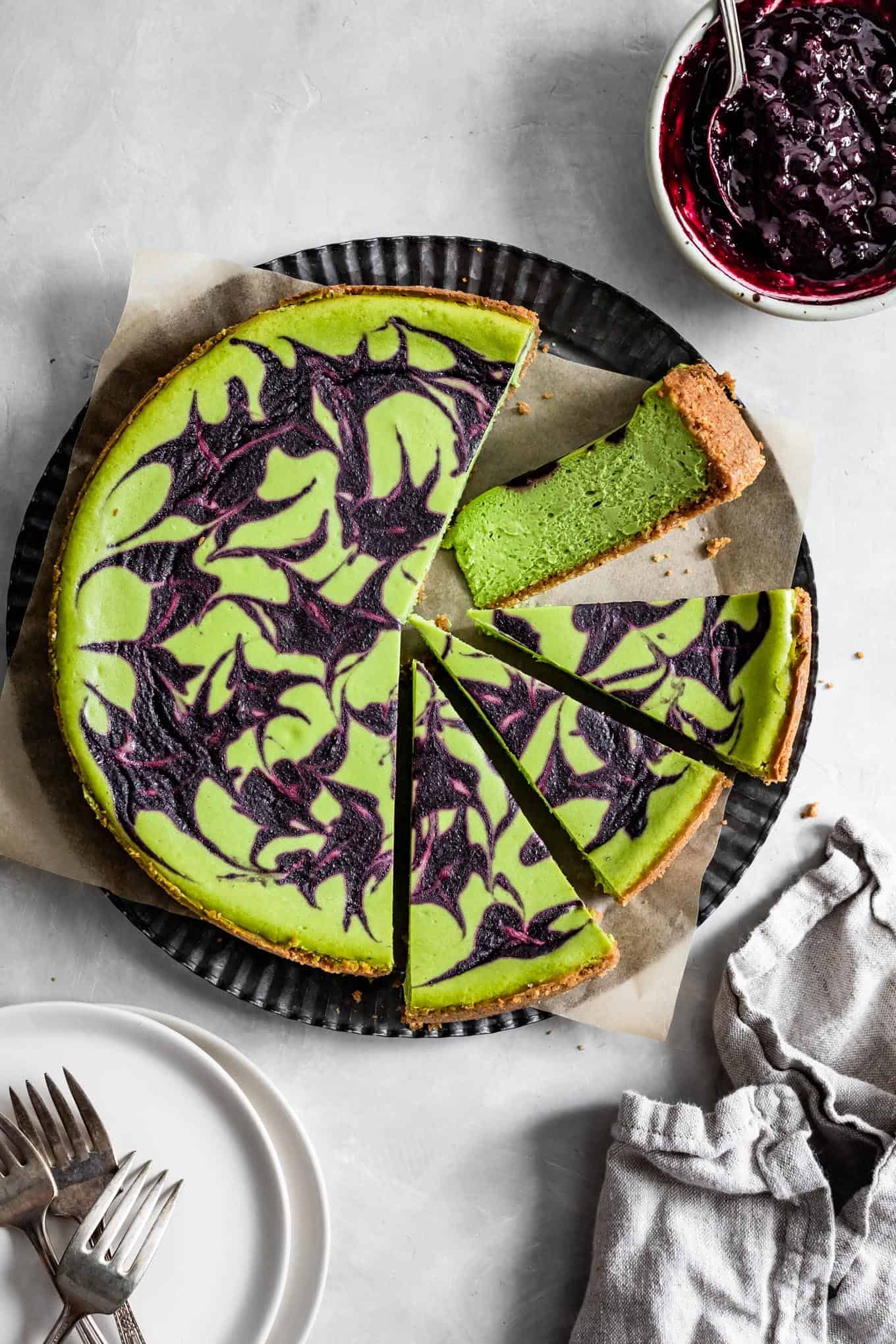 Baked Gluten-Free Matcha Cheesecake with Berry Swirl