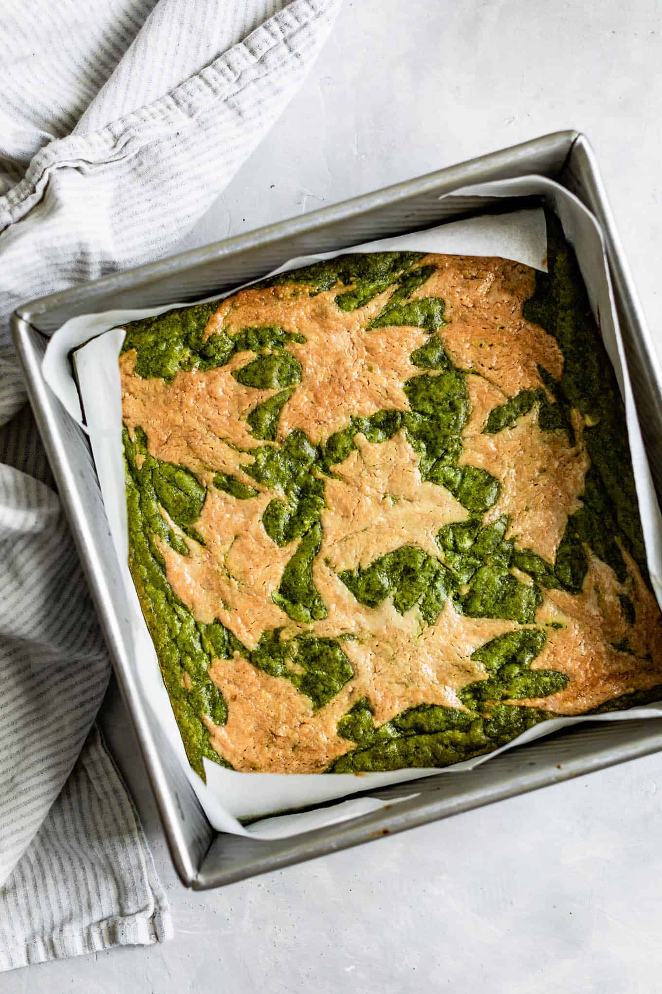 Baked Tahini-Swirl Matcha Brownies in Pan