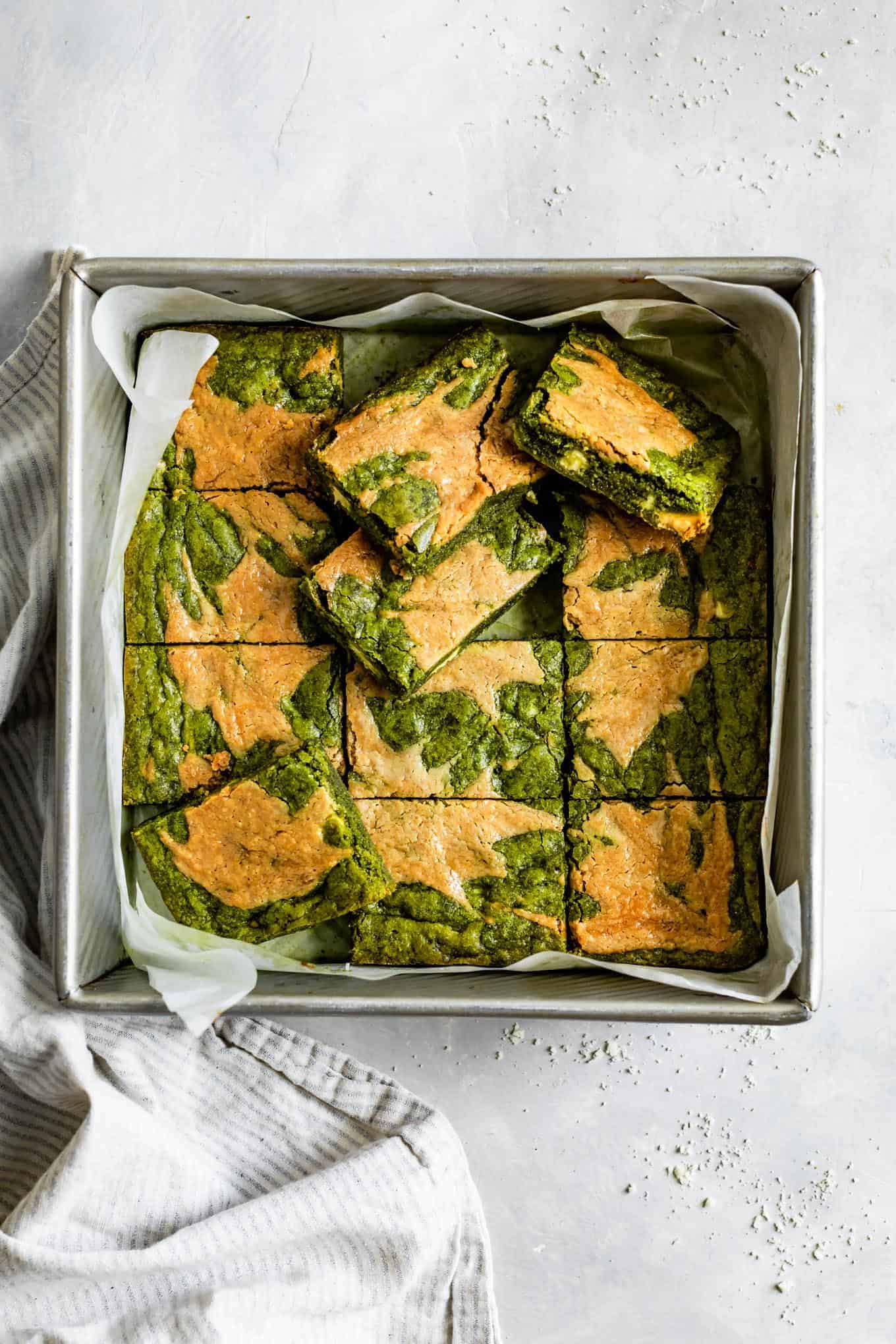 Sliced Gluten-Free Matcha Brownies with Tahini Swirl in Pan