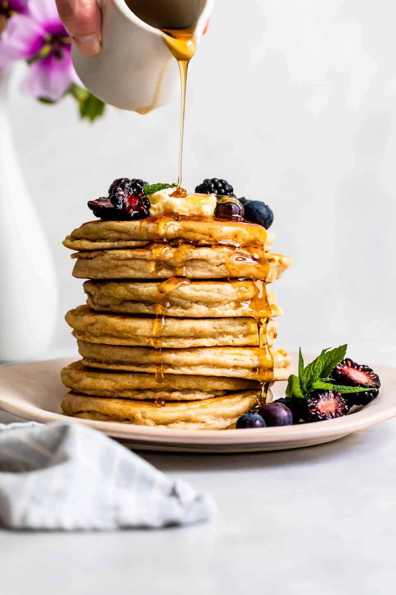 Syrup drizzling on the best gluten-free pancakes recipe