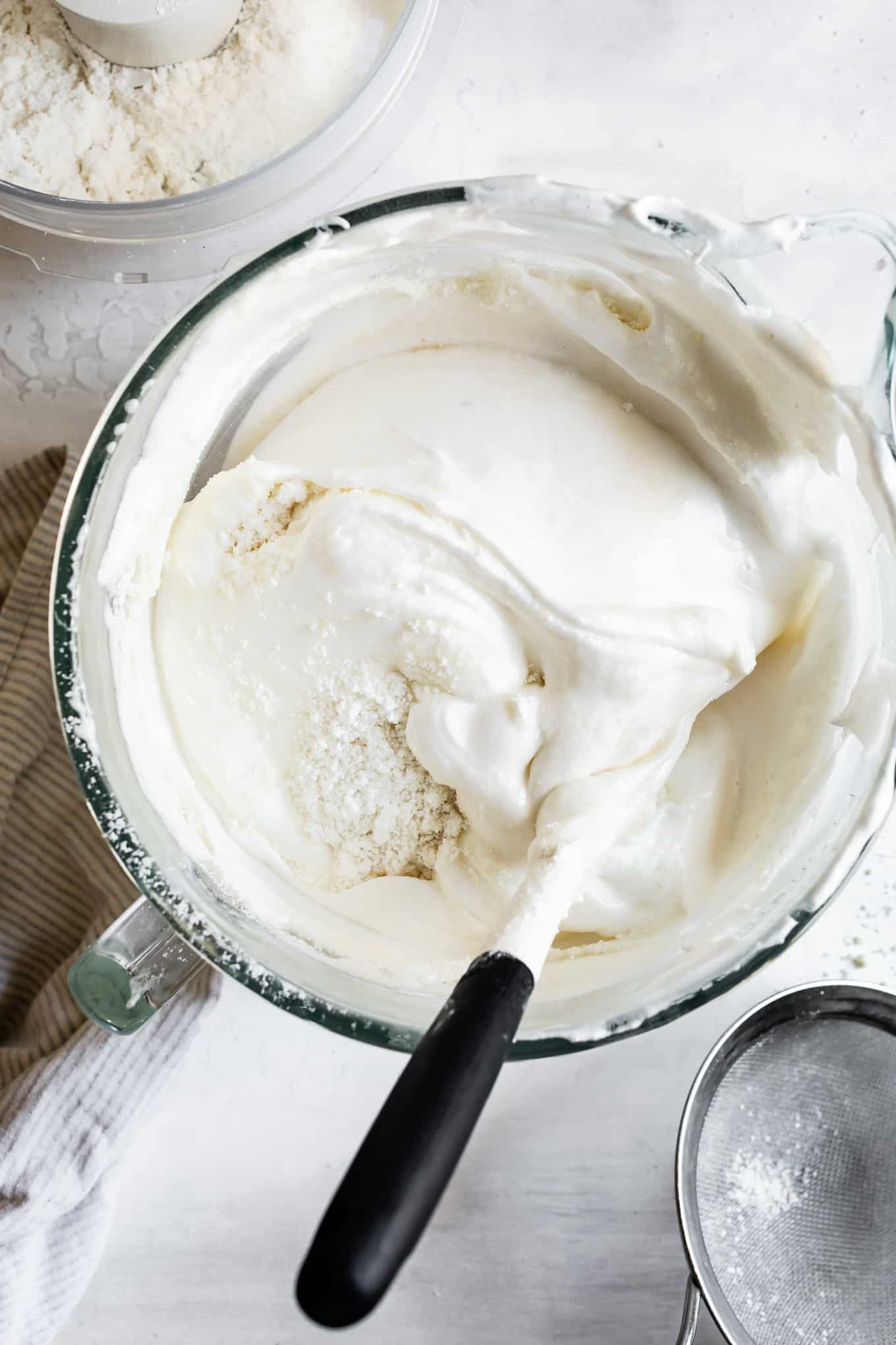 Folding flour into angel food cake