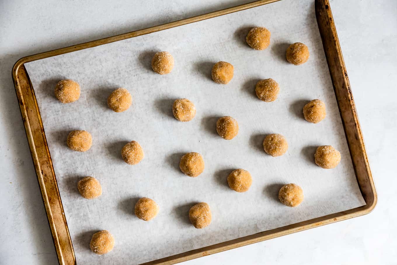 Baking Sheet of Peanut Butter Blossom Cookie Dough