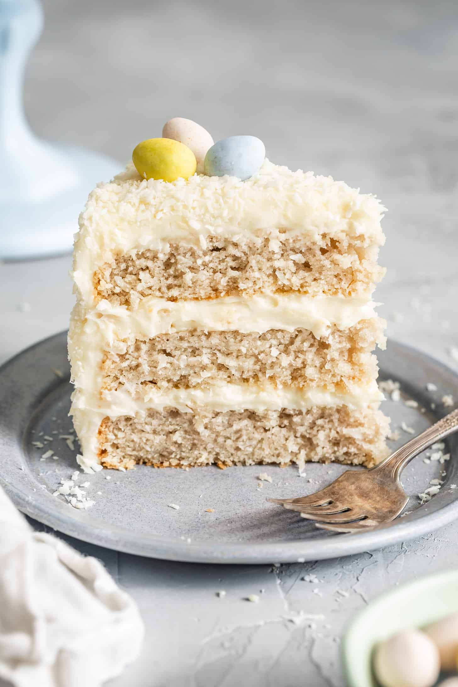 Slice of Gluten-Free Coconut Cake with Cream Cheese Frosting