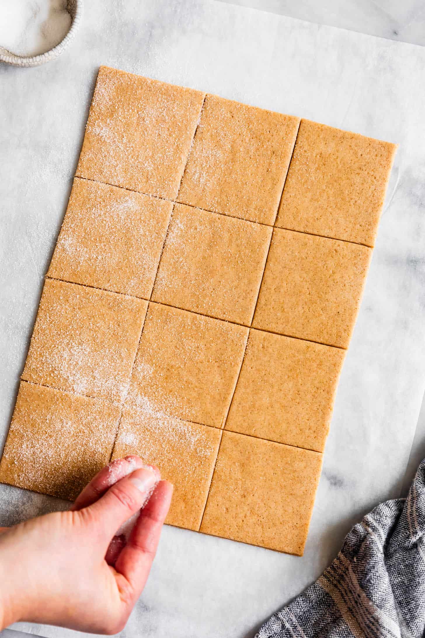 Sprinkling Sugar on Homemade Graham Crackers