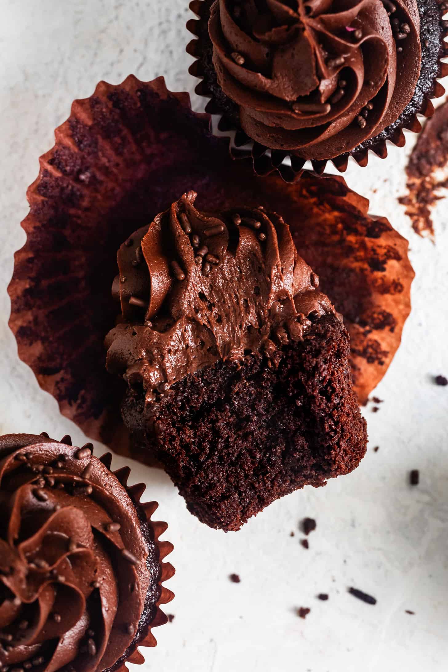 Bite of Gluten-Free Chocolate Cupcake with Chocolate Buttercream Frosting