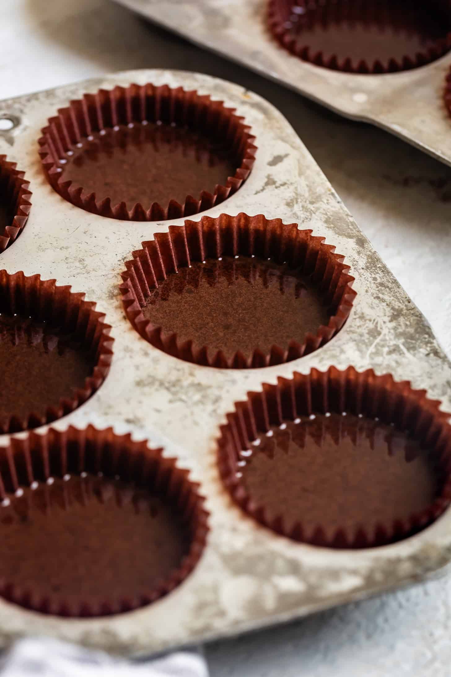 Pouring Chocolate Cupcakes into Muffin Tin