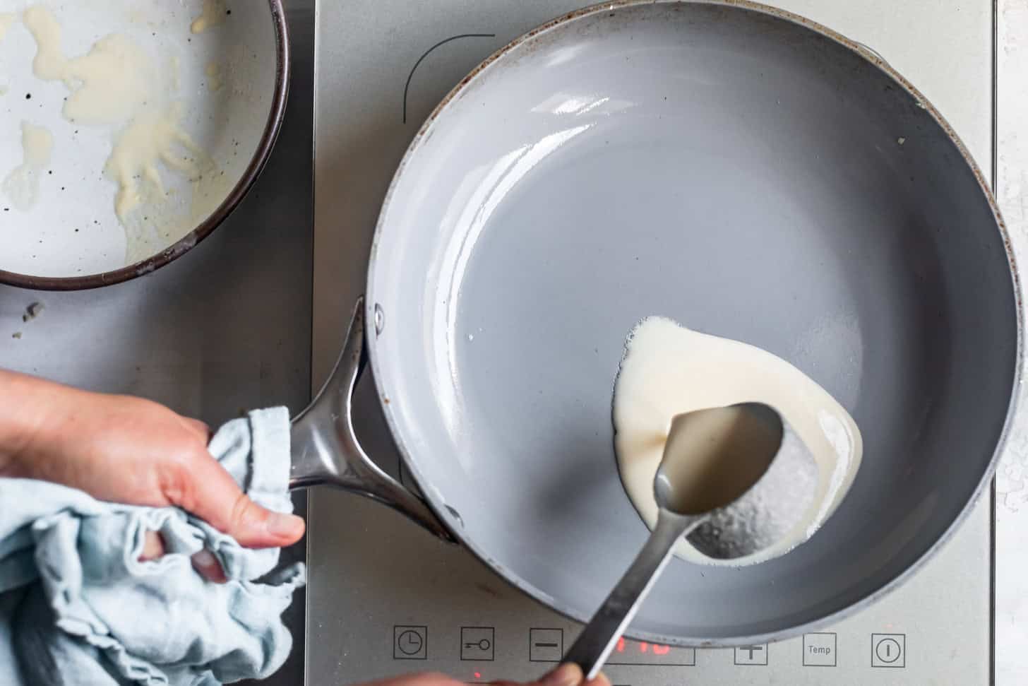 Pouring Crepe Batter in a Pan