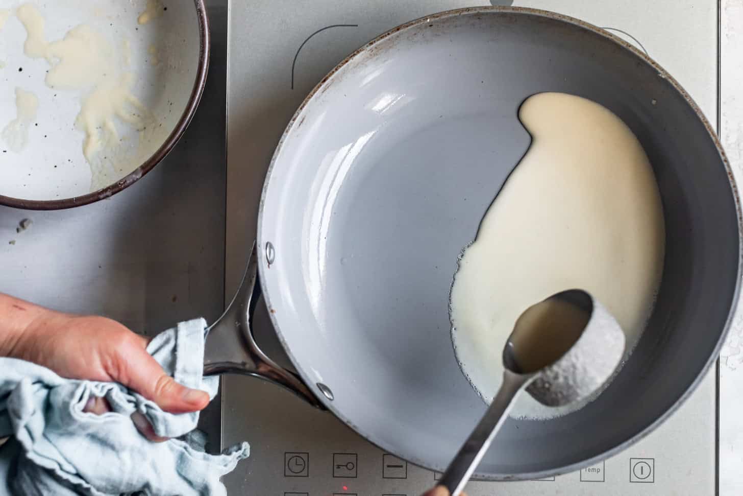 Swirling Crepe Batter in a Pan