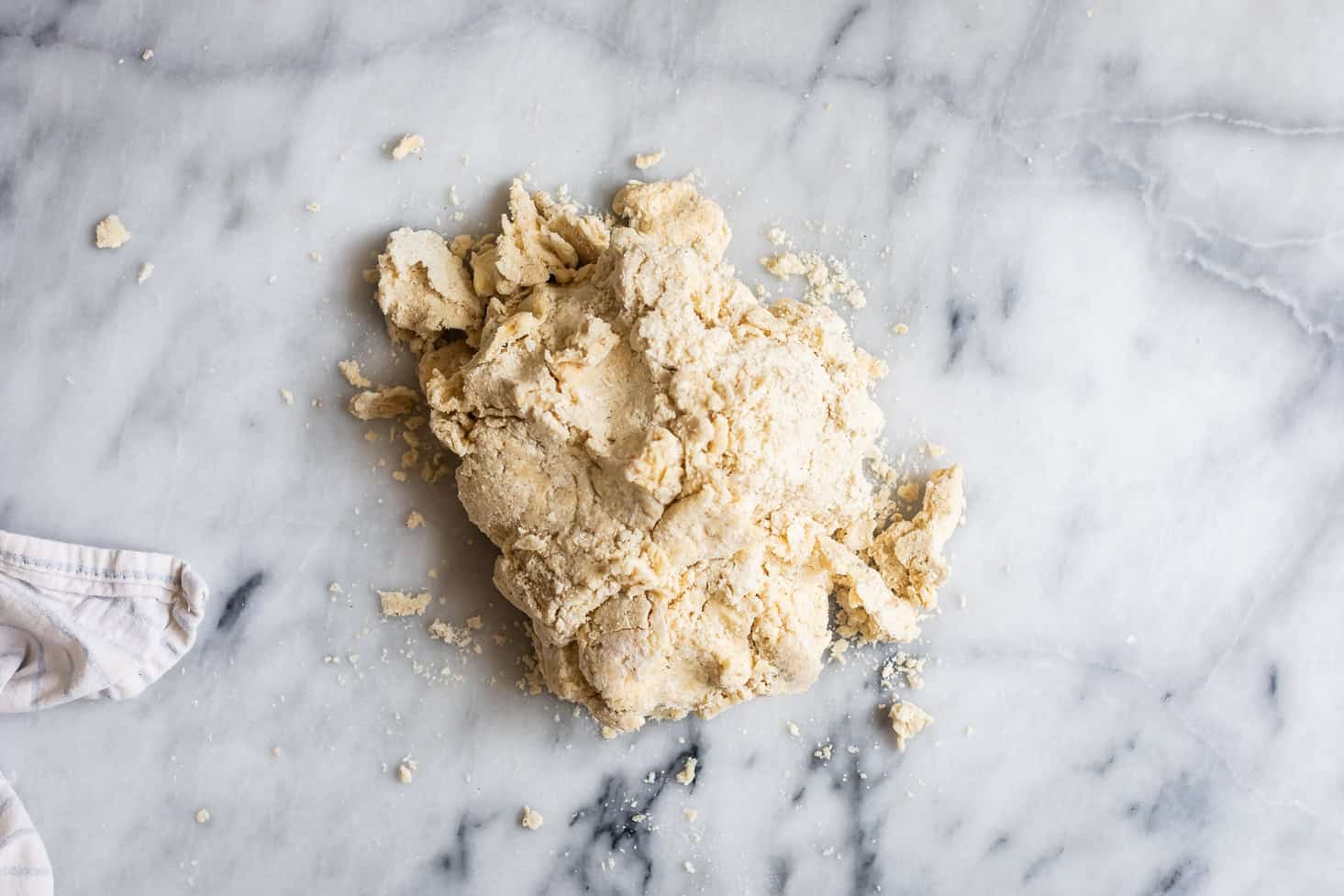 Dumping Gluten-Free Pie Dough Crumbs on Surface