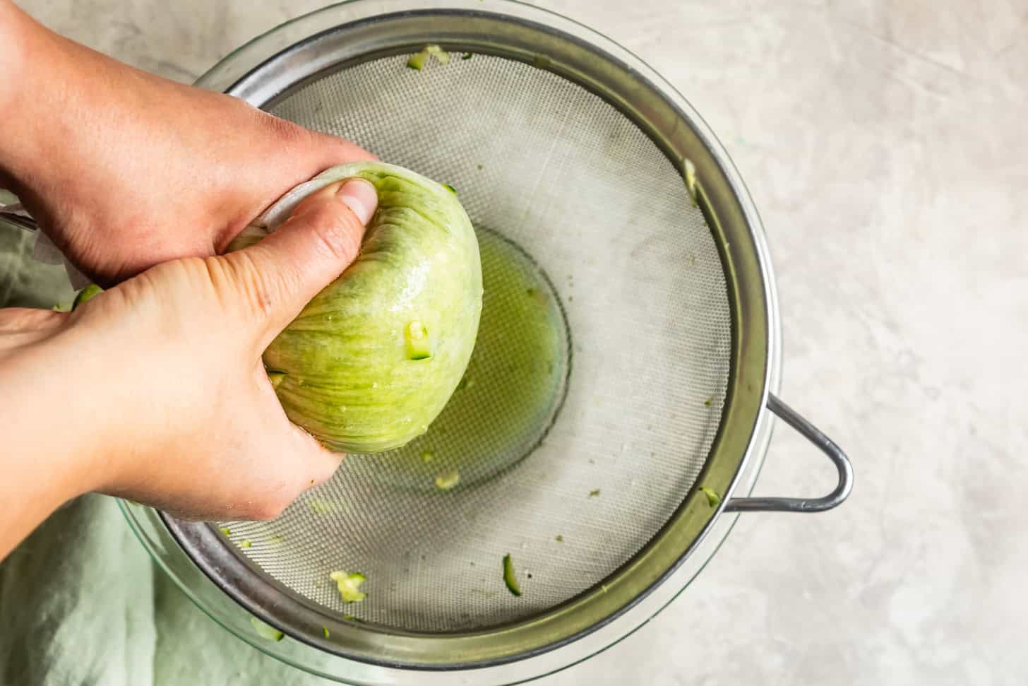 Squeezing Zucchini for Zucchini Bread