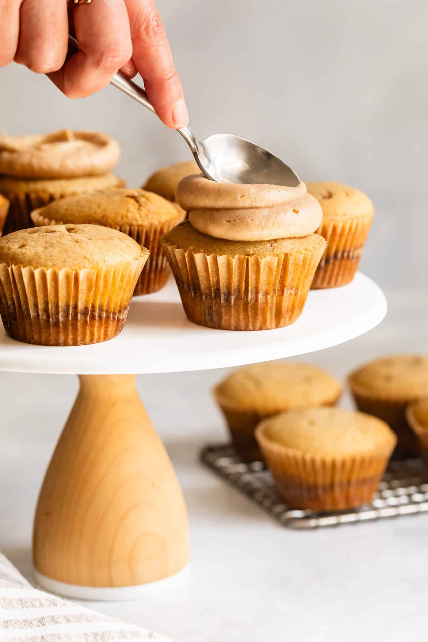 Use a Spoon to Swirl Cinnamon Frosting on Cupcakes