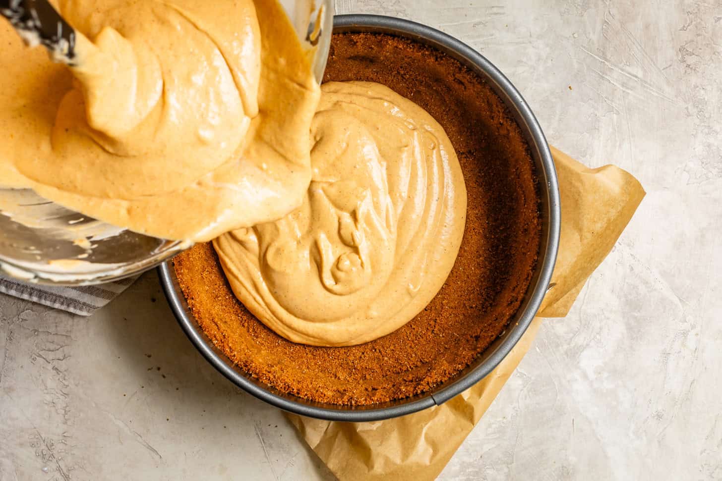 Pouring Cheesecake Filling into Crust