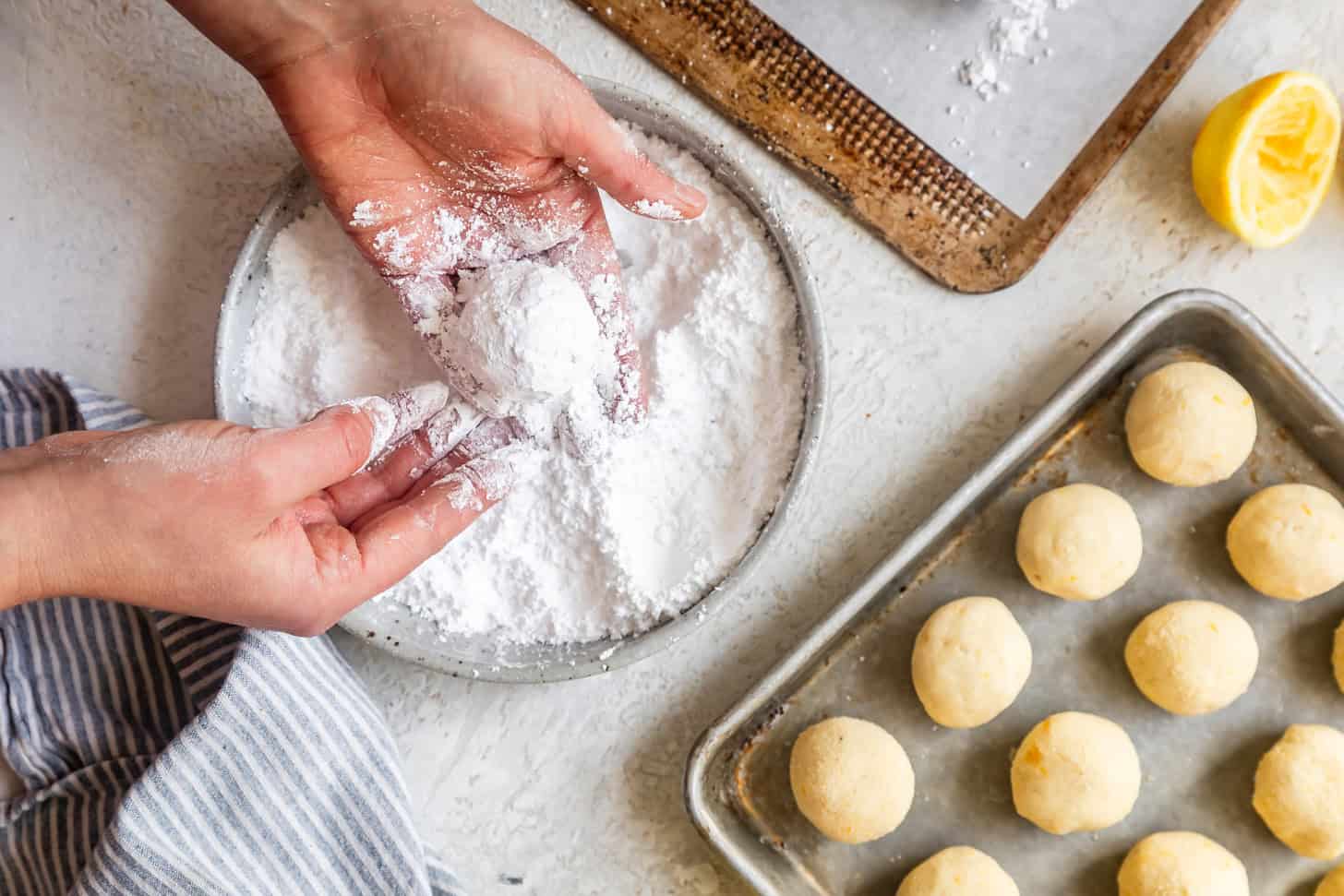 Rolling Cookie Dough in Powdered Sugar