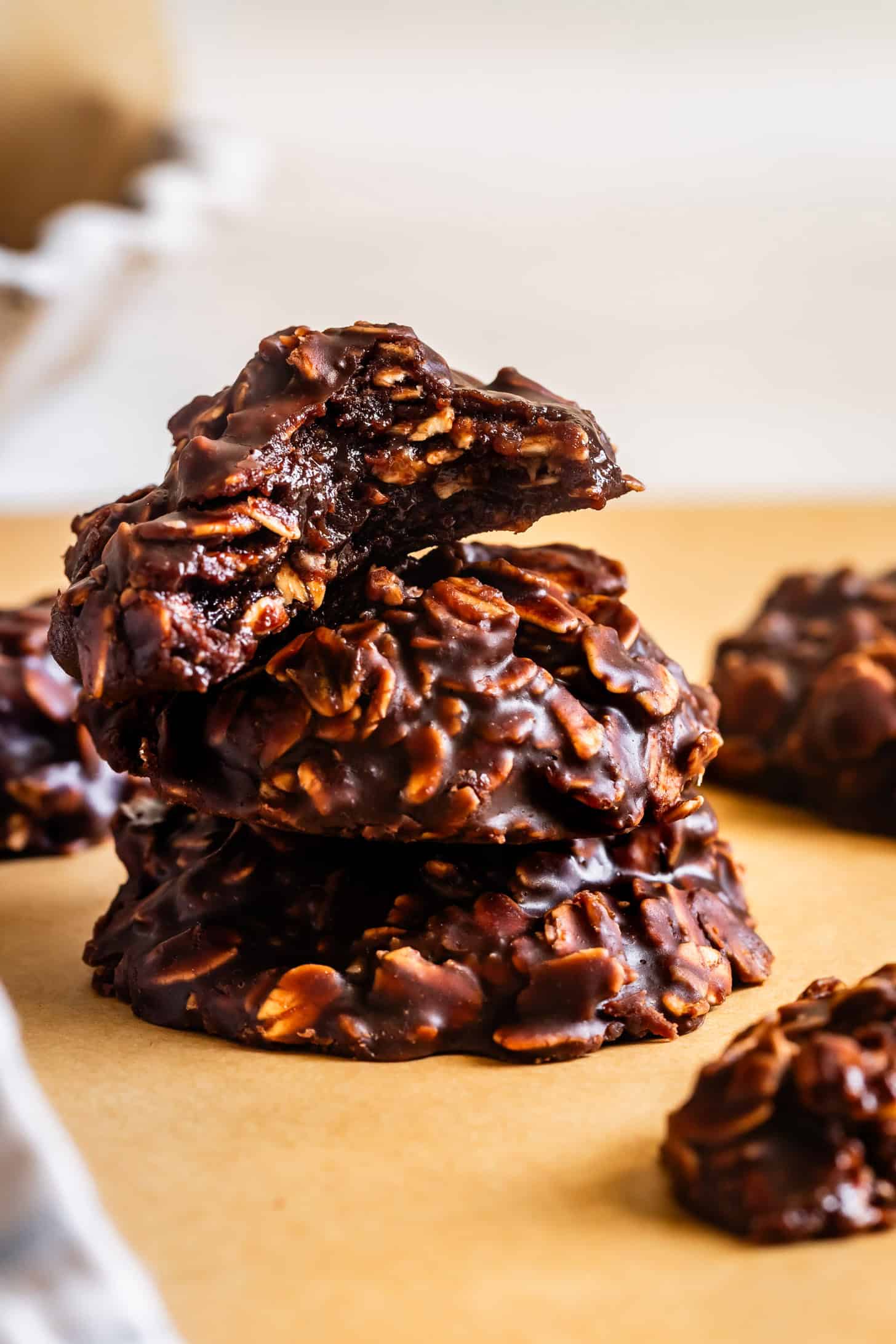 Bite out of chocolate peanut butter no-bake cookies with rolled oats.