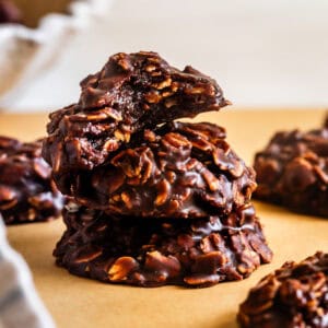 Bite out of chocolate peanut butter no-bake cookies with rolled oats.
