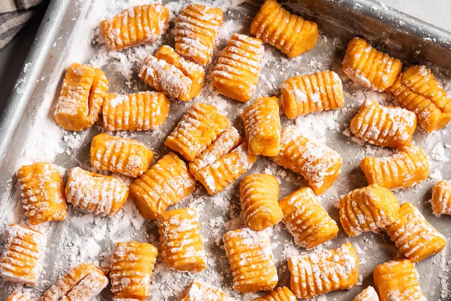 Gluten-Free Butternut Squash Gnocchi Uncooked on Baking Sheet