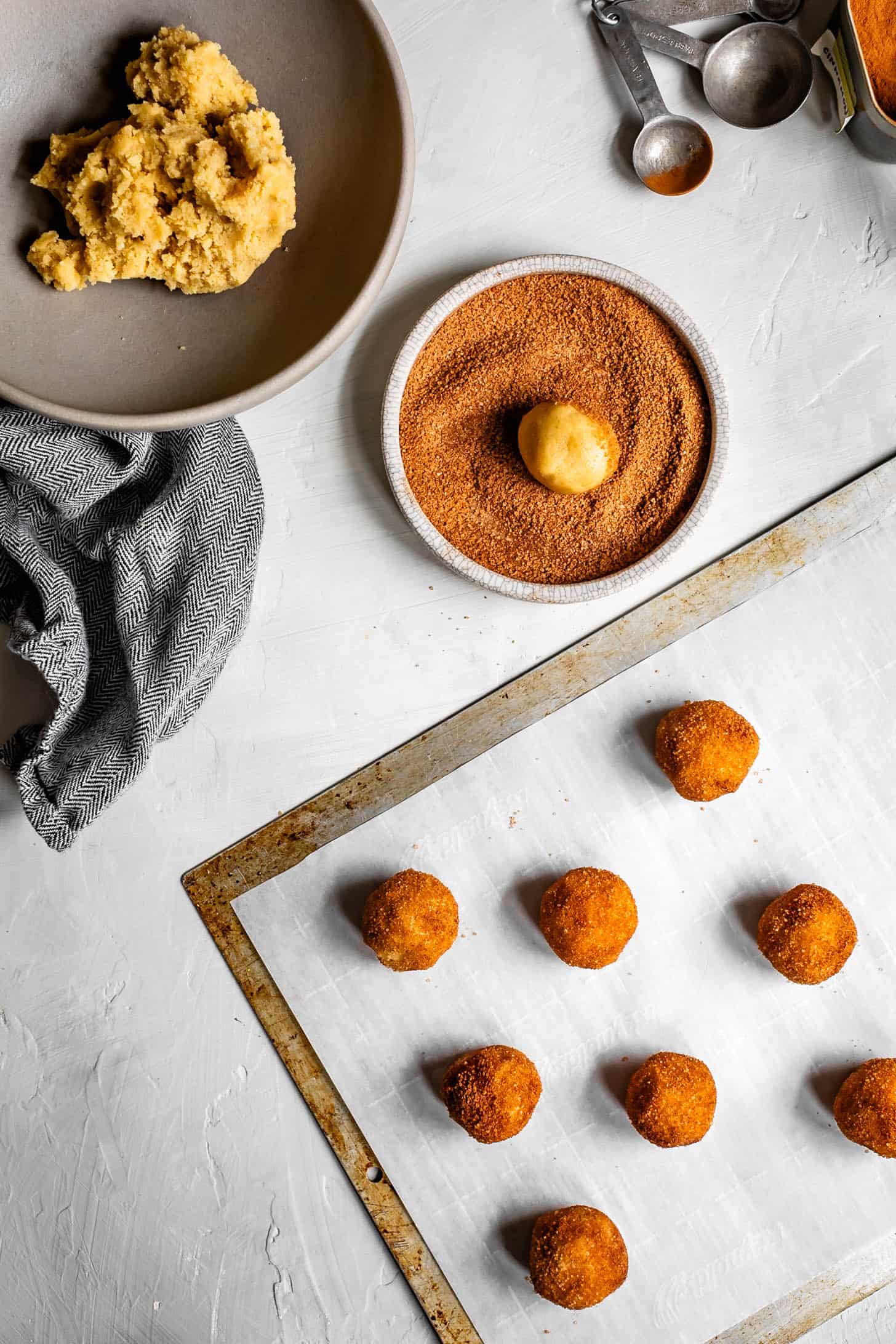 Gluten-Free Snickerdoodle Cookie Dough Balls on Baking Sheet