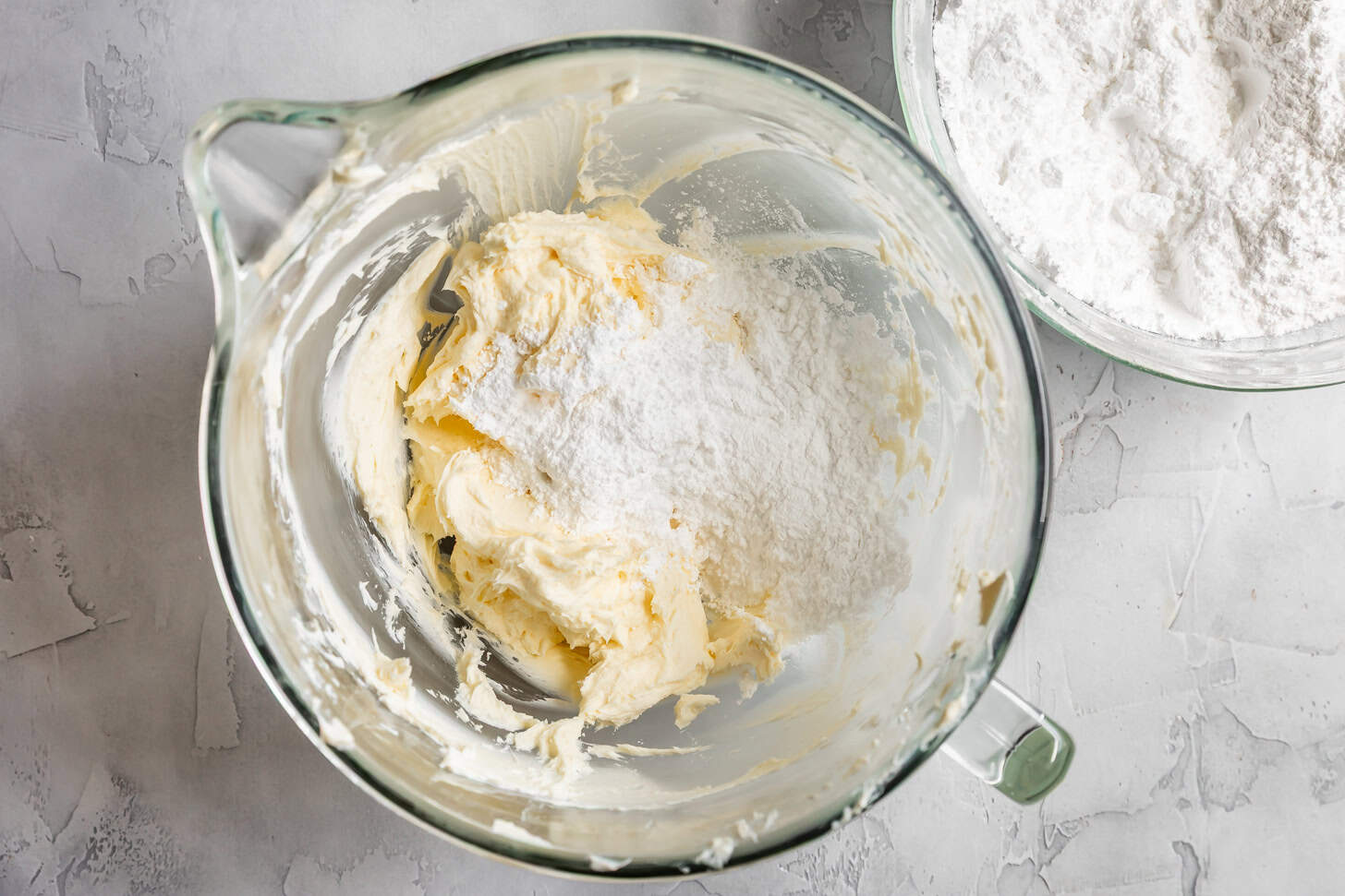 Adding in sifted powdered sugar