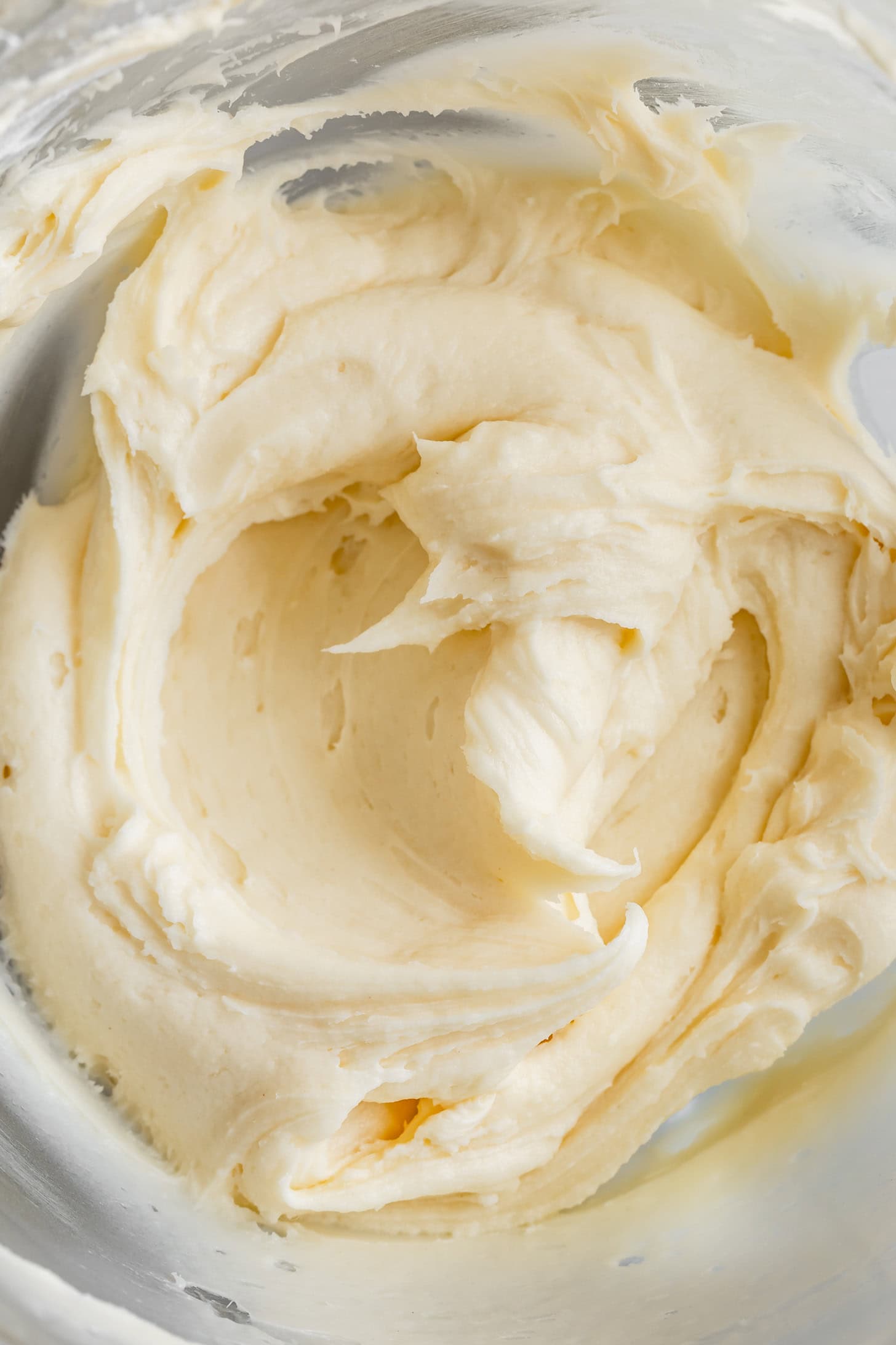 Swirls of Coconut Cream Cheese Frosting in a Bowl