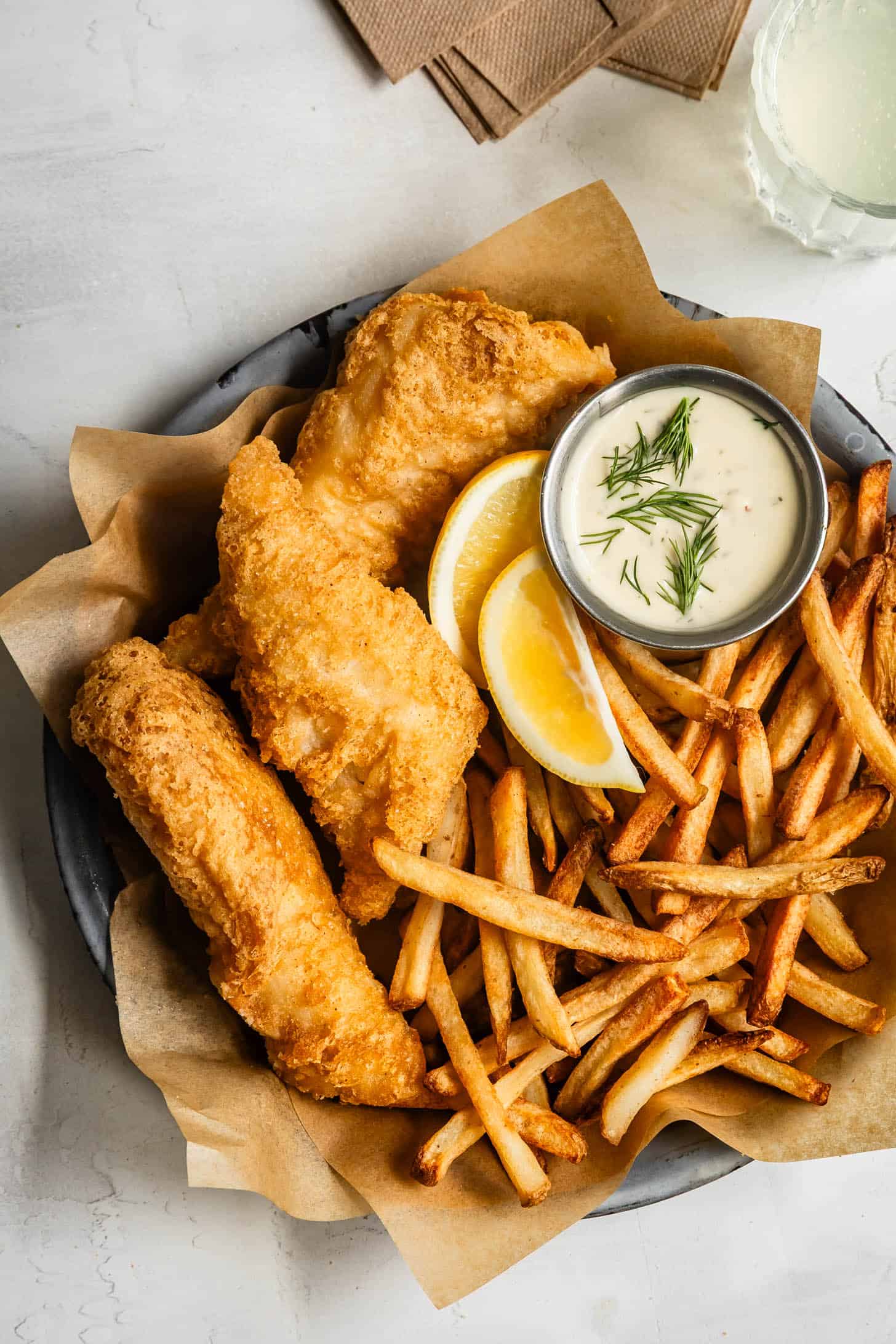 Homemade Gluten-Free Fried Fish with French Fries in a Basket