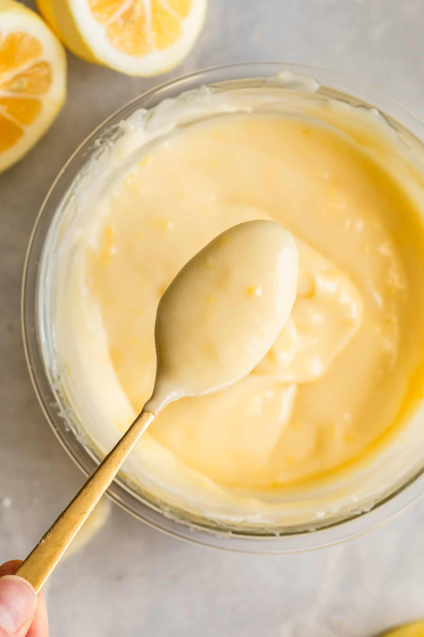 Glossy Lemon Cream Cheese Icing on a Spoon