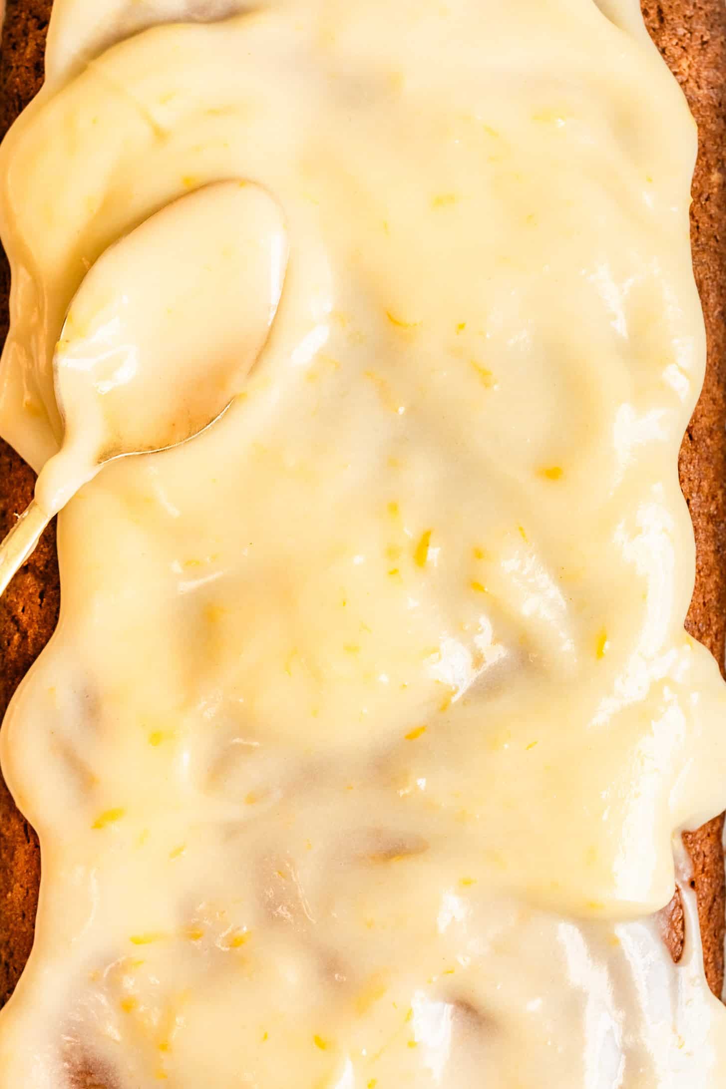 Silky Lemon Icing Swirled on Loaf Cake