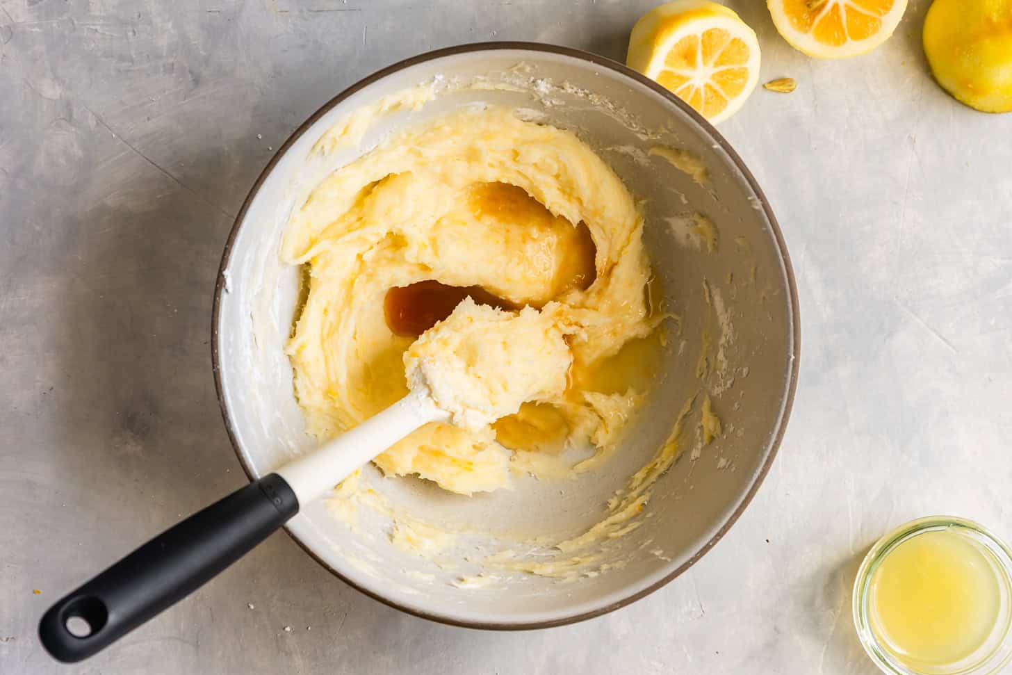 Add vanilla and lemon juice in parts, mixing until smooth