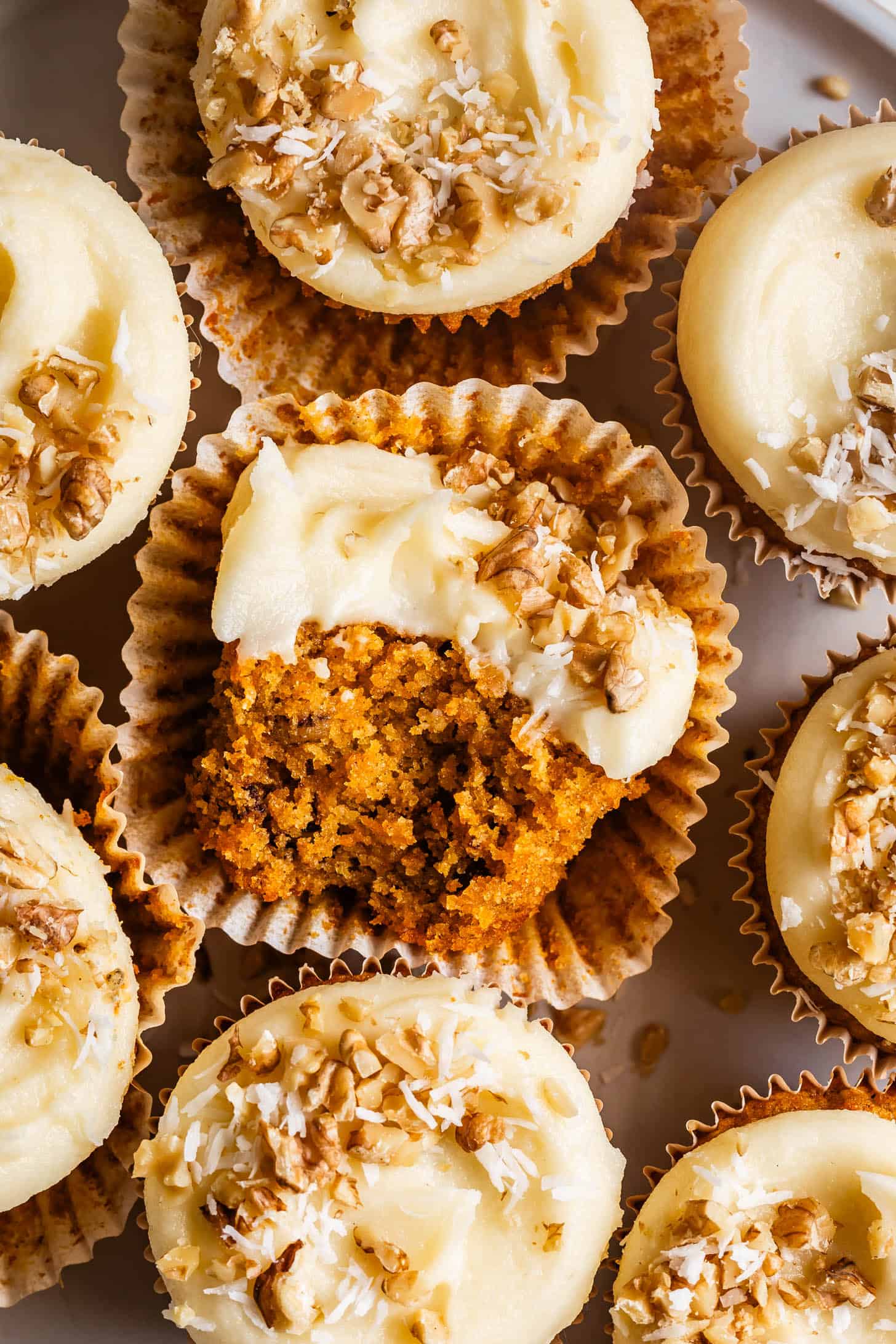 Gluten-Free Carrot Cupcakes Top Down with Bite Close-up