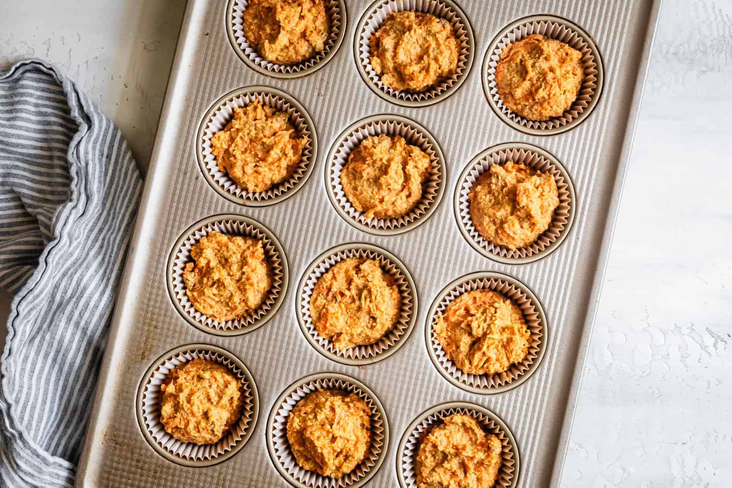 Unbaked Gluten-Free Carrot Cupcakes in Muffin Tin