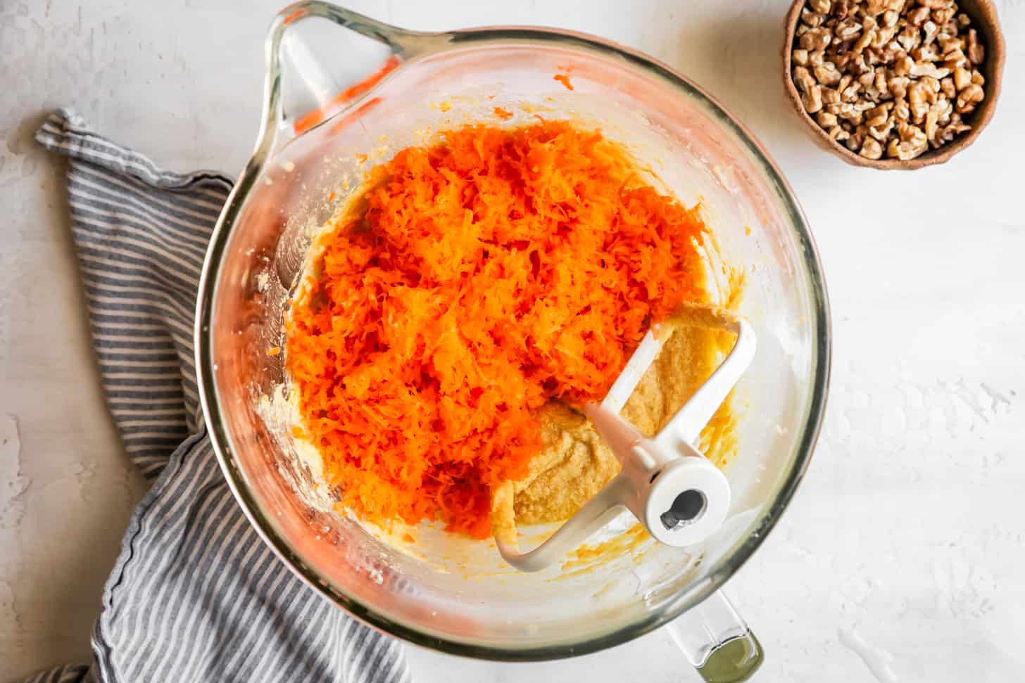 Mixing in Finely Grated Carrots to Cake Batter