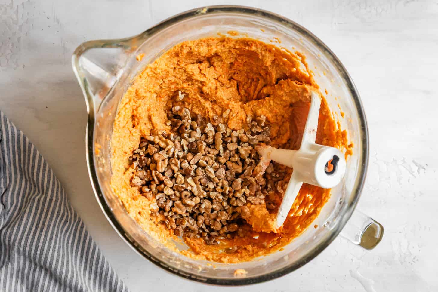 Folding in Walnuts to Gluten-Free Carrot Cupcakes